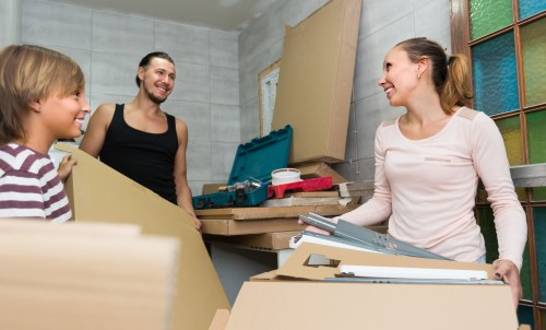 Removal team preparing a London home move with boxes and furniture