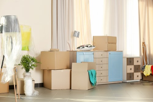 Furniture pick-up team handling bulky items in a London flat