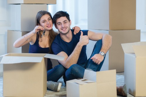 Office moving team preparing desks and equipment for a London business relocation