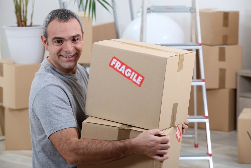Unloading household items at a London property during moving day