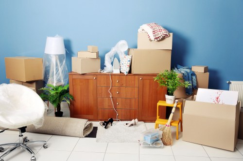 Worker safely loading furniture into a moving van