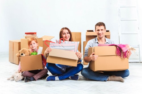 Removals team planning a London house move with boxes and furniture