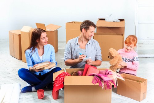 Office relocation setup with desks, chairs, and boxes in London