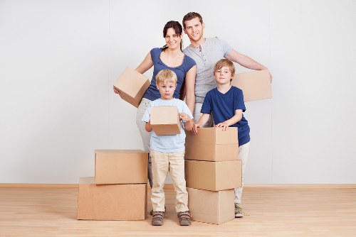 Local crew loading sofas and chairs for furniture collection in London